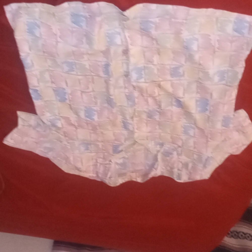 A lovely womans button up with beautiful pastel colors